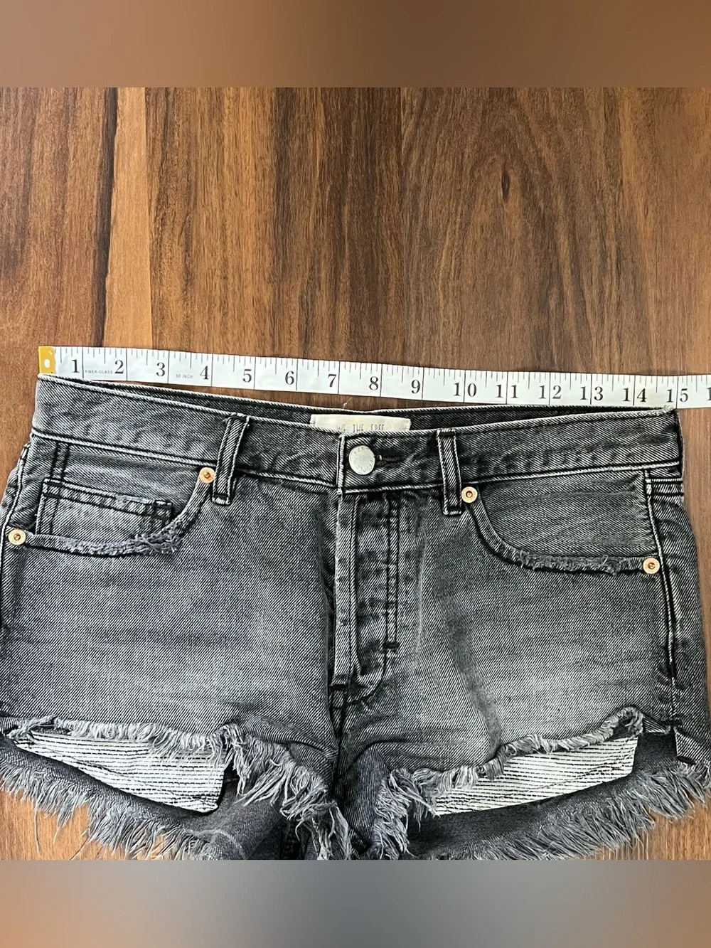 Free People black/charcoal low rise button fly denim cut off mini shorts